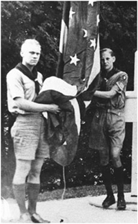 Gerald Ford (left) assists in raising the Fort Mackinac flag in 192